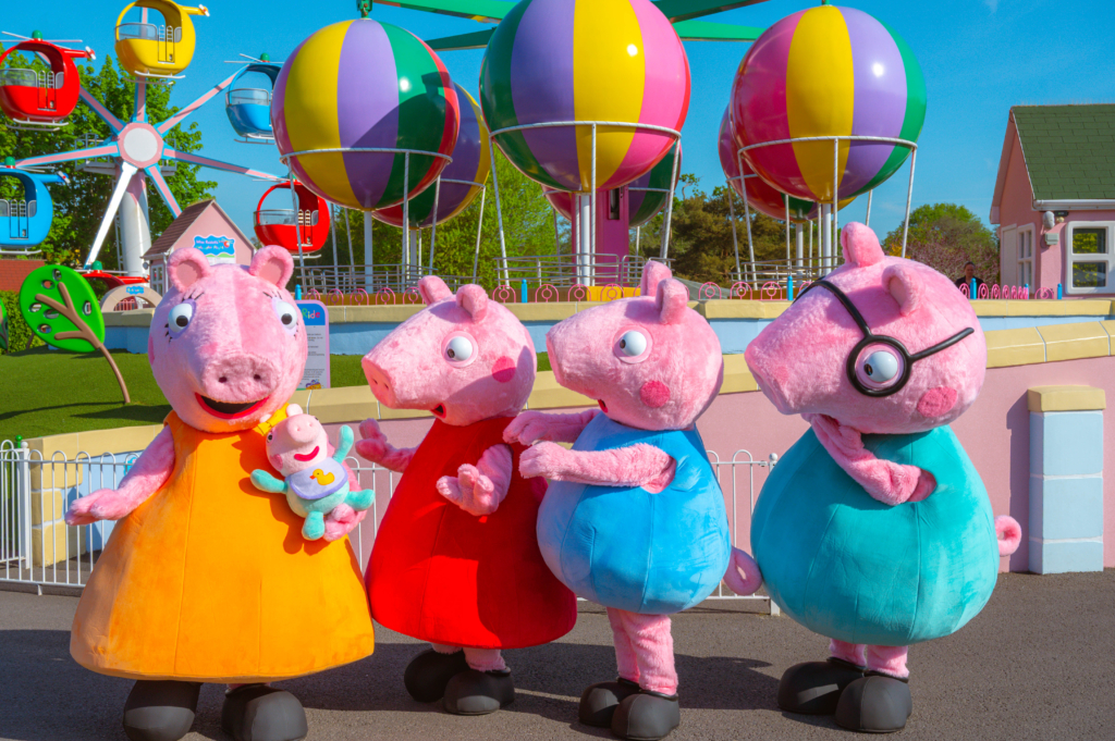 Mummy and Daddy Pig, Evie Pig, Peppa Pig and George at Peppa Pig World. UK.